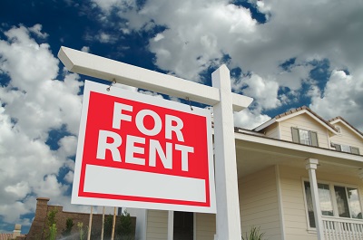 image of house with for rent sign in front