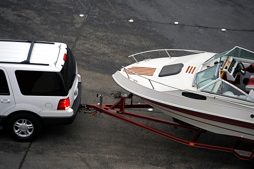 SUV Hauling Boat on Trailer