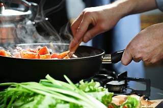 image of woman cooking