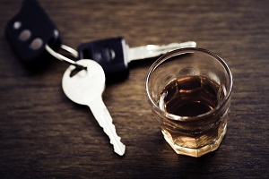 car keys next to alcoholic drink