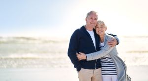 Elderly Couple Standing on a Beach
